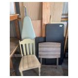 Two folding tables, a TV tray, one chair and ironing board
