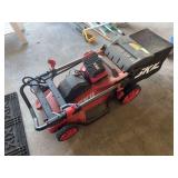Skil battery powered mower with bagger, charger, and battery