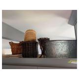 Baskets and large galvanized tub on top of kitchen cupboards