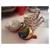 Three sets of ceramic measuring cups