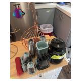 Coffee carafe, hand shredder, salt and pepper grinders and salt and pepper crocks, plus banana fruit basket