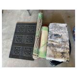 Assortment of rugs, including large, washable rug