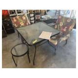 Glass top square patio table with two chairs and small glass top side table