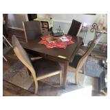 Small square dining table with two self storing leaves and 4 padded chairs