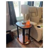 Pair of matching oval wooden end tables, with one table lamp with USB port and salt lamp