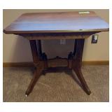 Walnut parlor table w/ porc casters