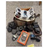 Pentax ME camera, various photographic filters, flashes, camera bag