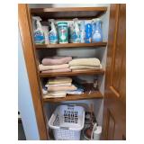 Towels, laundry basket, cleaning supplies, light bulbs, etc
