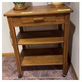 Rolling oak stand 19D x 27L x 33H