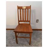 Five oak straight back chairs
