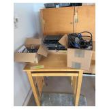 Computer table keyboards box of cords and a smart ups battery