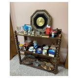 Contents of shelf includes clock, trolls, cups & saucers, VHS tapes, etc