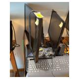 22” LG monitor, 28” ASUS monitor, two keyboards, two mice and speakers Monitors power on