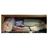 Blankets on top shelf of closet