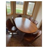 48x42 dining table with (1) 18” leaf and 6 chairs on wheels