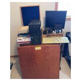 Wooden card table, sewing cabinet now living its best life as a desk, Acer monitor, Labtec keyboard, mouse, speakers, LG monitor, etc