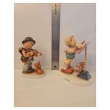 Hummel 'Little Maestro' figurine, Model number 826/I.  Goebel Hummel porcelain figurine is titled 'Puppy Love' and features a young boy playing the violin for his dog, marked #1