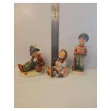 Vintage Goebel Hummel figurine known as 'Soldier Boy', Model Number: HUM 332. Goebel Hummel figurine entitled 'Happy Pastime,' model number Hum 69, depicting a young girl knitting with a small black b