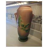 Vintage Roseville pottery vase featuring a sculpted botanical design in pink and green tones, Columbine pattern