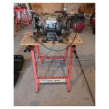 Bench grinder on workbench