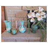 Weller Pottery in the 'Dogwood' pattern, featuring a matte light green glaze with white blossoms. With flowers in candle