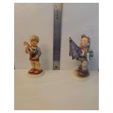 M.I. Hummel 'Is It Raining?' (HUM 420), which depicts a young schoolboy holding a large purple umbrella and a book.  Hummel Goebel 'Nutcracker Sweet' Figurine (Hum #2130)