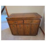 Drexel Accolade campaign-style console, featuring flip-top extension leaves, brass hardware