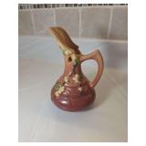 Roseville Pottery ewer vase from the Snowberry line, produced in the United States during the mid-20th century. Pattern/Line: Snowberry, featuring a floral motif of white berries and green leaves on b