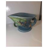 Roseville Pottery Bushberry cornucopia vase in the blue glaze pattern, first introduced around 1941. Pattern: Bushberry, featuring raised berries and leaves on a textured blue background