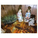 Man and woman figurines; rabbit and grass figurine