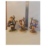 Goebel M.I. Hummel figurine titled 'Apple Tree Boy' (Hum 142).  Goebel Hummel 'Apple Tree Girl' figurine, identified by mold number 141.  Goebel M.I. Hummel figurine titled 'An Apple A Day' (Hum 403),