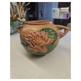 Vintage Roseville Pottery 'Water Lily' pattern vase, featuring raised pink flower and green leaf motifs on a matte brown background