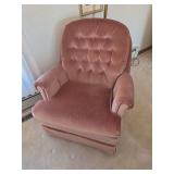 Pink velvet swivel rocker chair