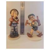 Two Goebel Hummels - Serenade Figurine #85, depicting a young boy in a top hat playing a flute and 'The Little Architect,' model number HUM 410/I