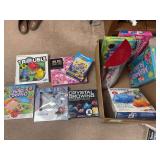 Box of puzzles and kids games plus a Holiday Barbie