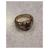 14K marked ring with aquamarine ? Center stone