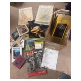 World War II life magazine, nature and outdoor reference type books, maps, and National Geographic’s