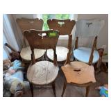 Five old dining chairs waiting to be repurposed