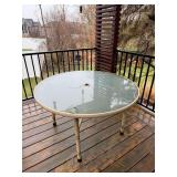 Glass topped patio table 45” round