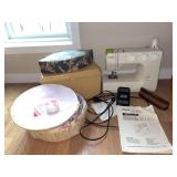 Kenmore sewing machine and notions Model 385.12102