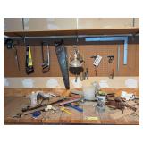 Tools and misc on pegboard and on bench