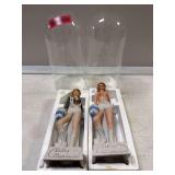 2 Dallas Cowboy Cheerleader bottles under glass