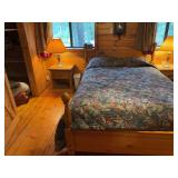 Queen size bed with wood frame, and wooden nightstand with lamp - steep stairs!