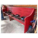 Wooden church pew, painted red