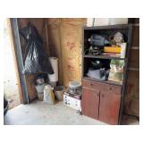 ￼ Catalytic heater,  buckets, trash bag full of empty coffee cans, wooden cabinet with misc