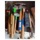 Hand tool assortment includes hammers, rubber mallet, ball peen hammer, hatchet, sledgehammer