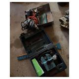 Two drills and drill bit sharpener