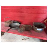 Cast-iron items, including pot, griddle, Wagner skillet and kettle