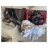 Hard side gun case, large group of game bags, harness of some sort, Elk bugle tube, gun bipod