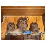 Funky wood piece with three hairy creatures